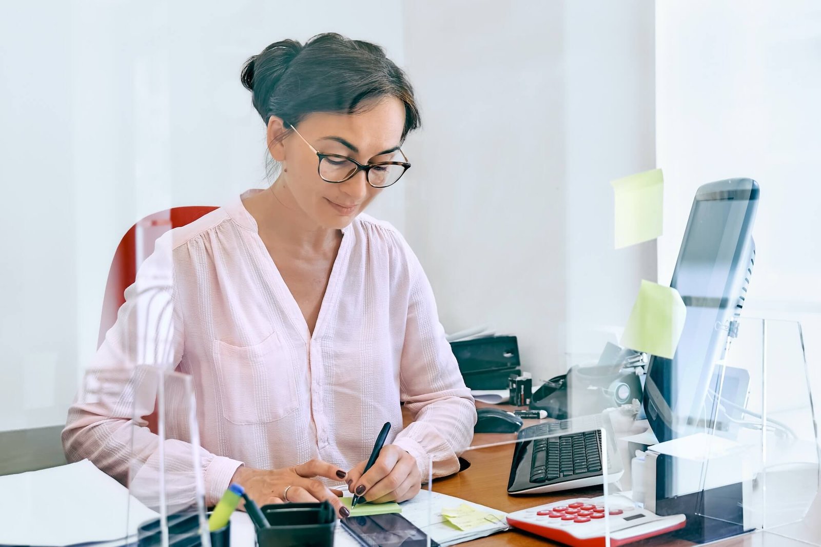 attentive-female-bookkeeper-check-accounts-bills-.jpg