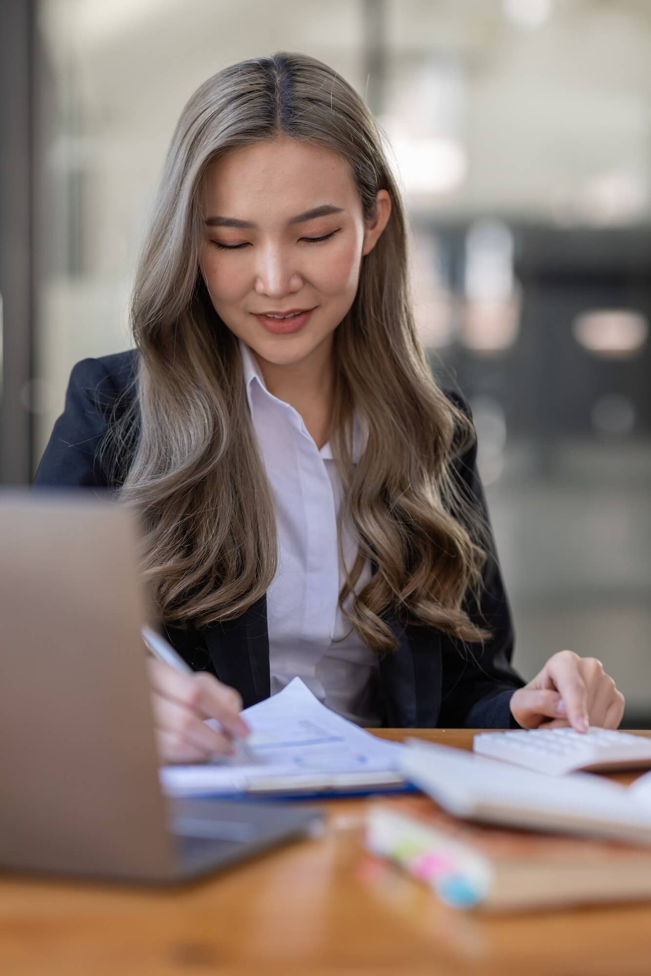 business-asian-woman-or-accountant-bookkeeper-working-on-calculator-to-calculate-business-data-1-1.jpg